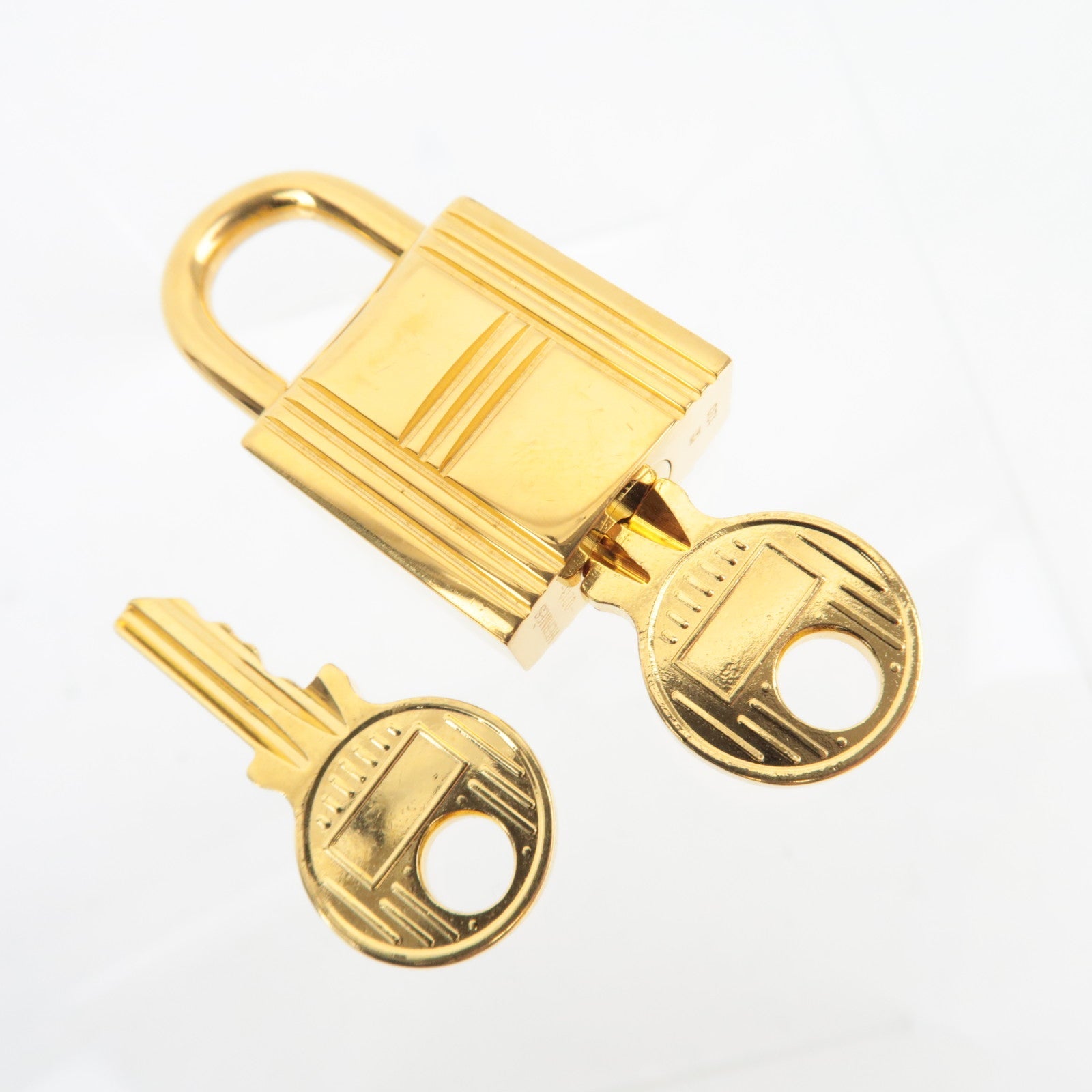 HERMES Key Lock 120 Metal Gold
