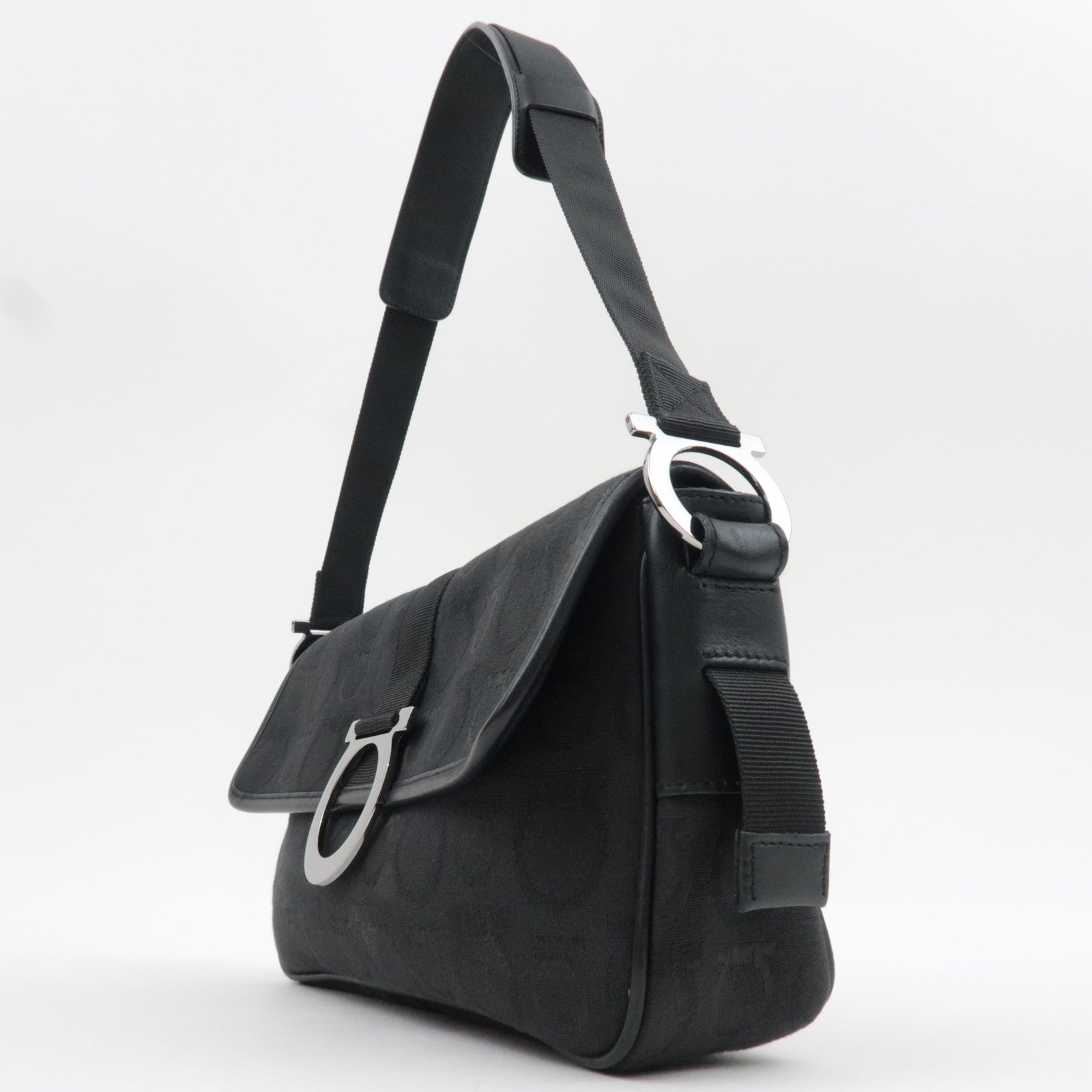 Ferragamo Gancini Shoulder Bag Canvas Leather Black side view showcasing the strap and flap design.