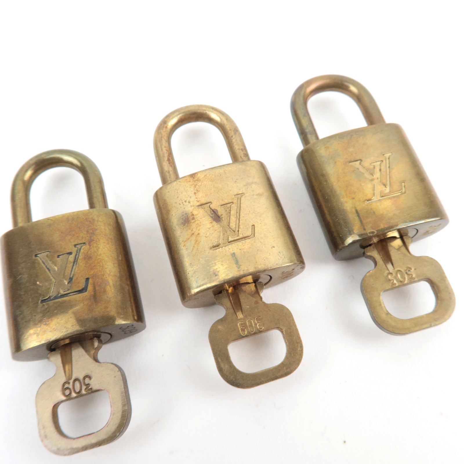 Louis Vuitton Set of 10 Key Locks Cadena Set Metal Gold Color