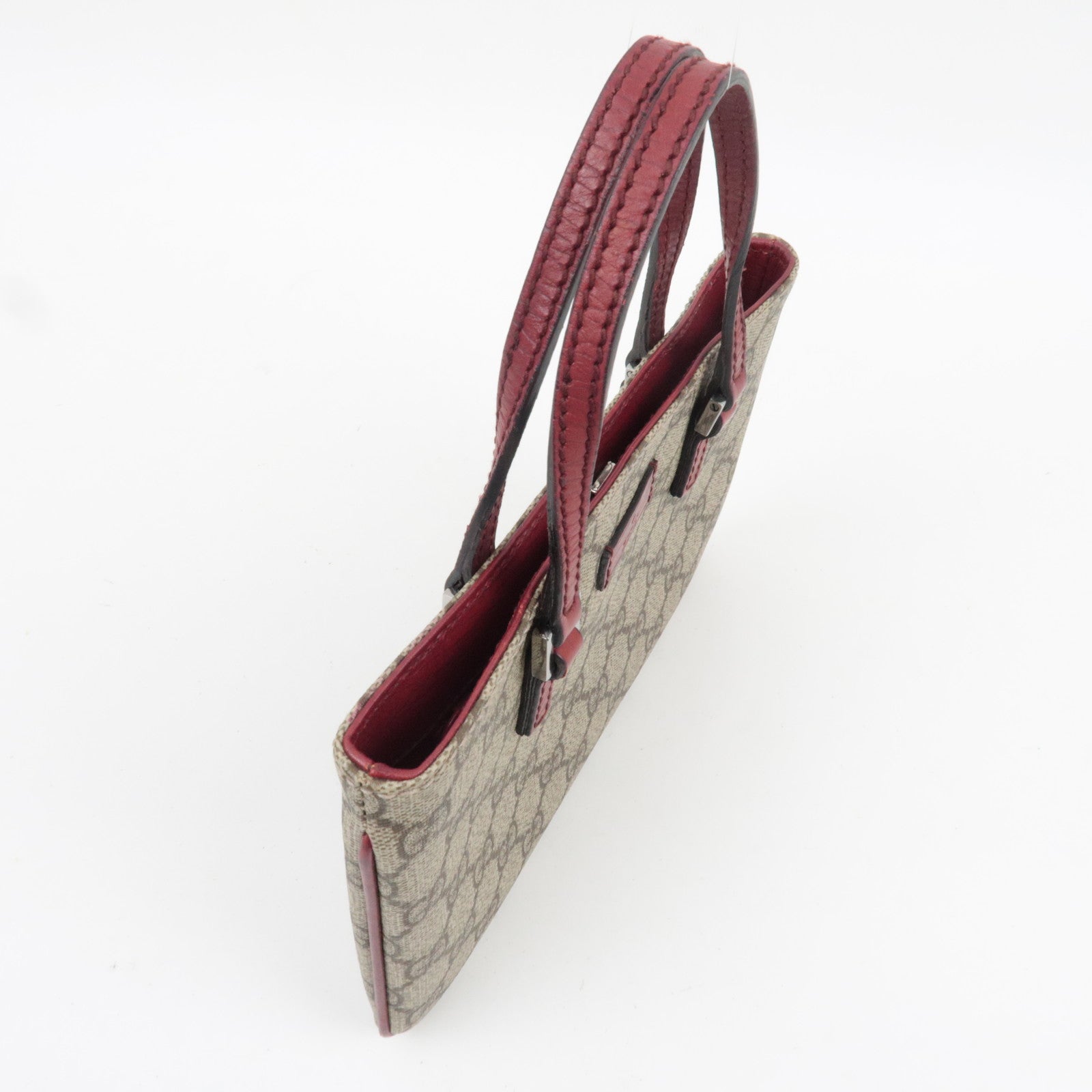 GUCCI Handbag GG Supreme Leather Beige Bordeaux 114599, side view showcasing leather handles and GG Supreme pattern.