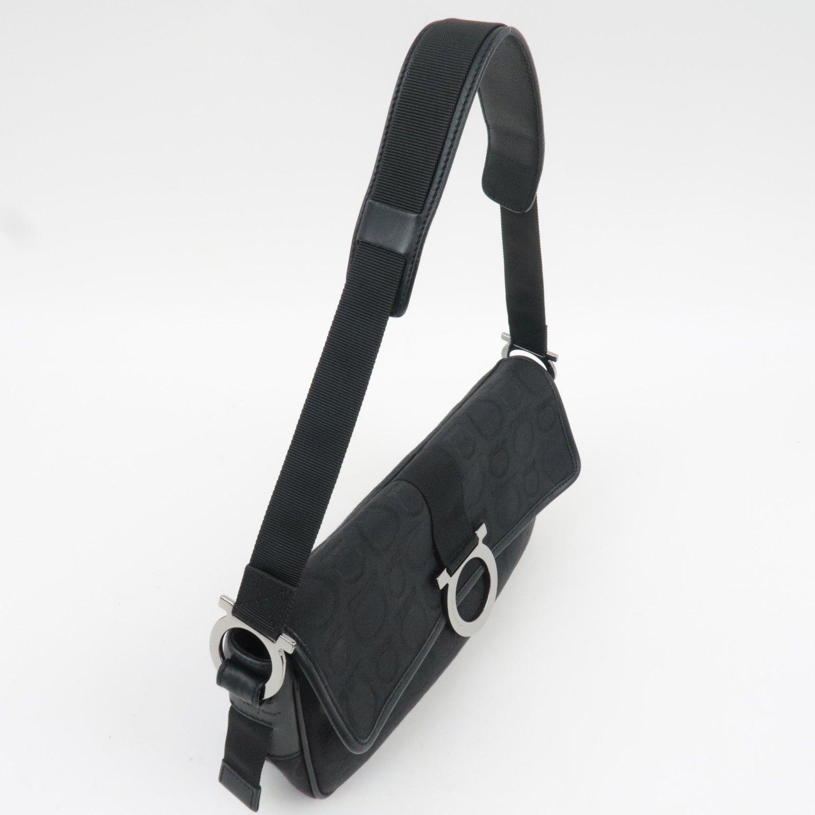 Ferragamo Gancini Shoulder Bag Canvas Leather Black in profile view with adjustable strap.